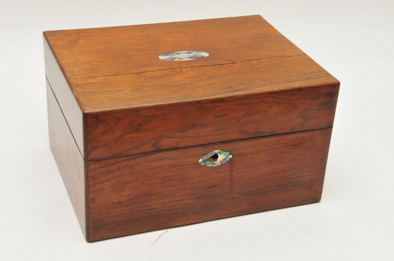 A walnut box travelling box with fitted interior and plated topped glass jars