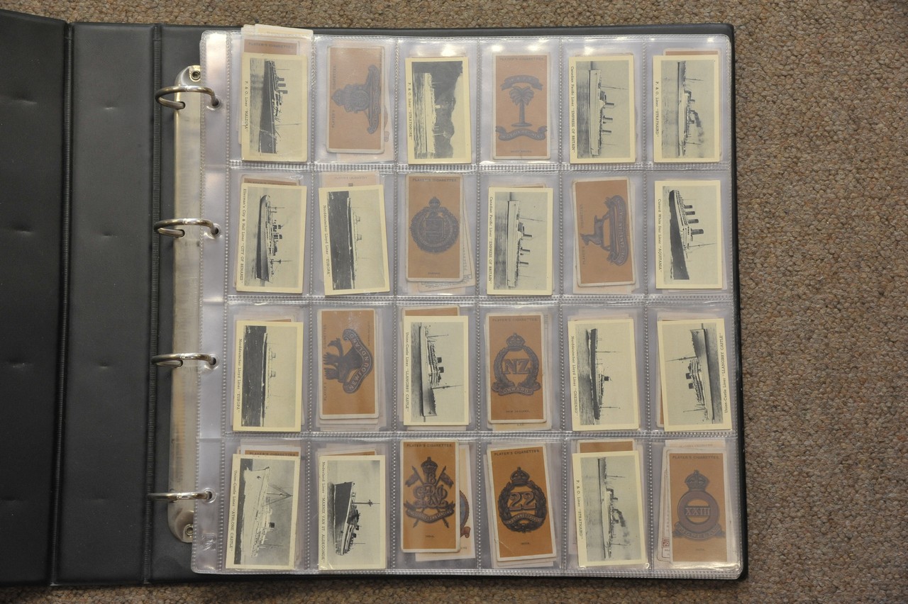 An album containing various cigarette cards