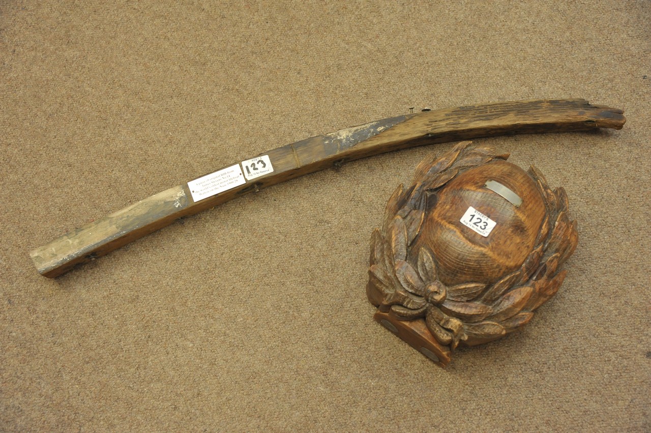 Two items of wooden shipping memorabilia comprising a piece carved with leaves from the HMS Aurora
