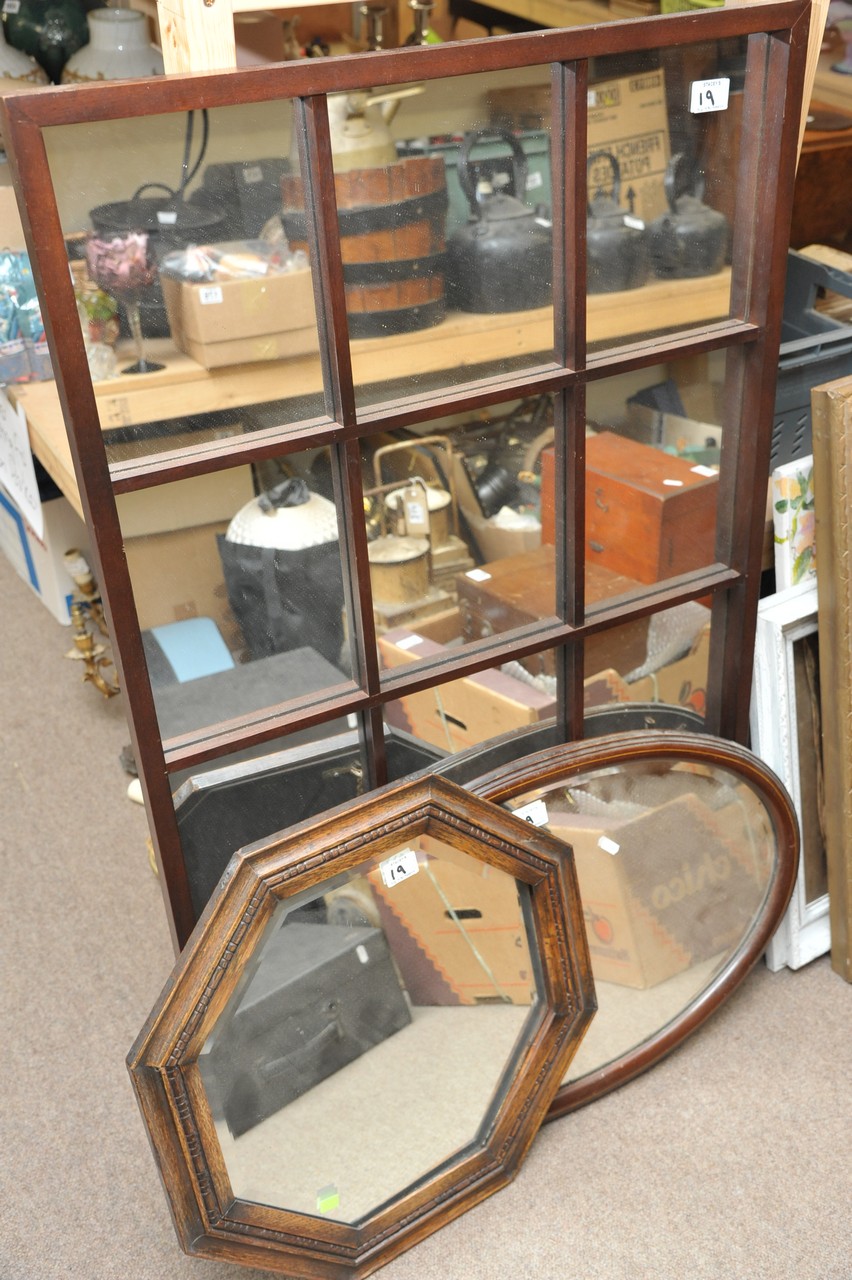 A large modern mirrored wall panel and two oak wall mirrors