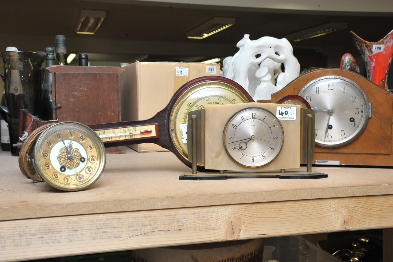 A barometer, a mantle clock and a Metamec clock