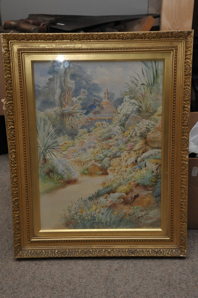 An original framed watercolour showing garden scene, signed Edith. E. Morris, June 1912.