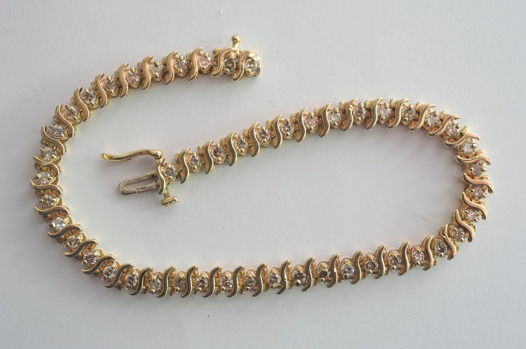 A 14ct yellow gold diamond set bracelet