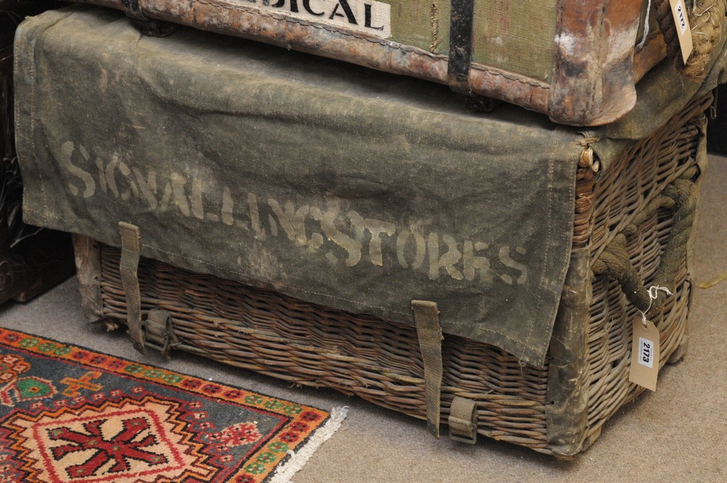 A canvas topped wicker army trunk