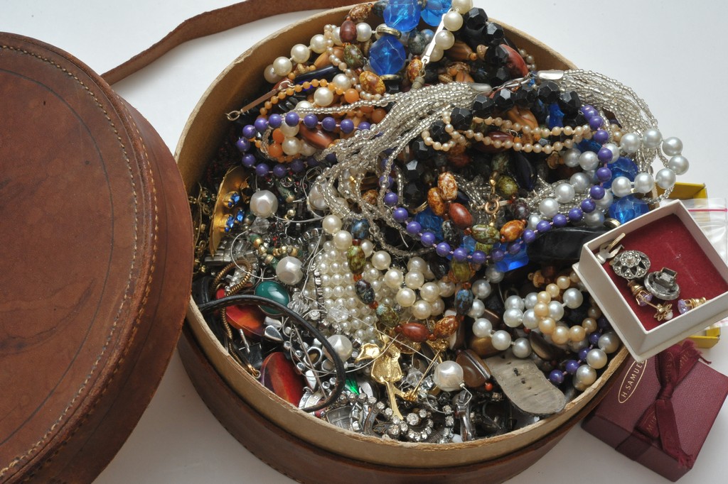 A leather collar box containing a quantity of dress jewellery various.