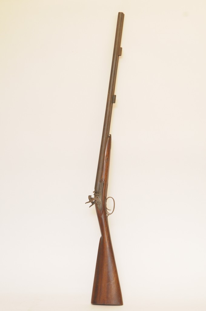A 19th century muzzle loading side by side percussion cap shotgun having Damascus twist barrels