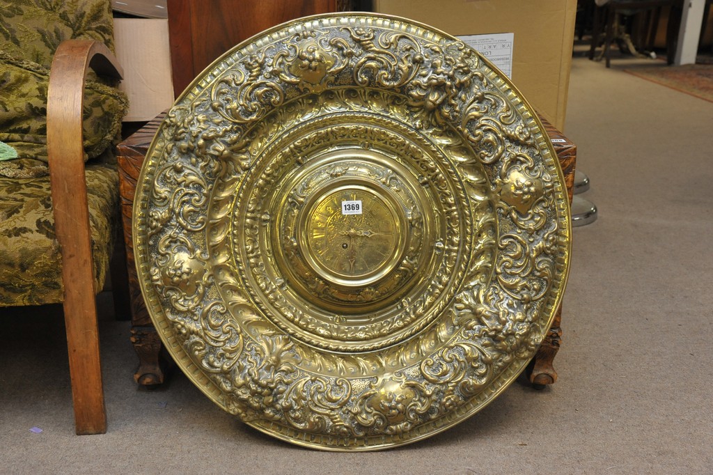 A brass Lenzkirch wall clock set in very large scrolled surround