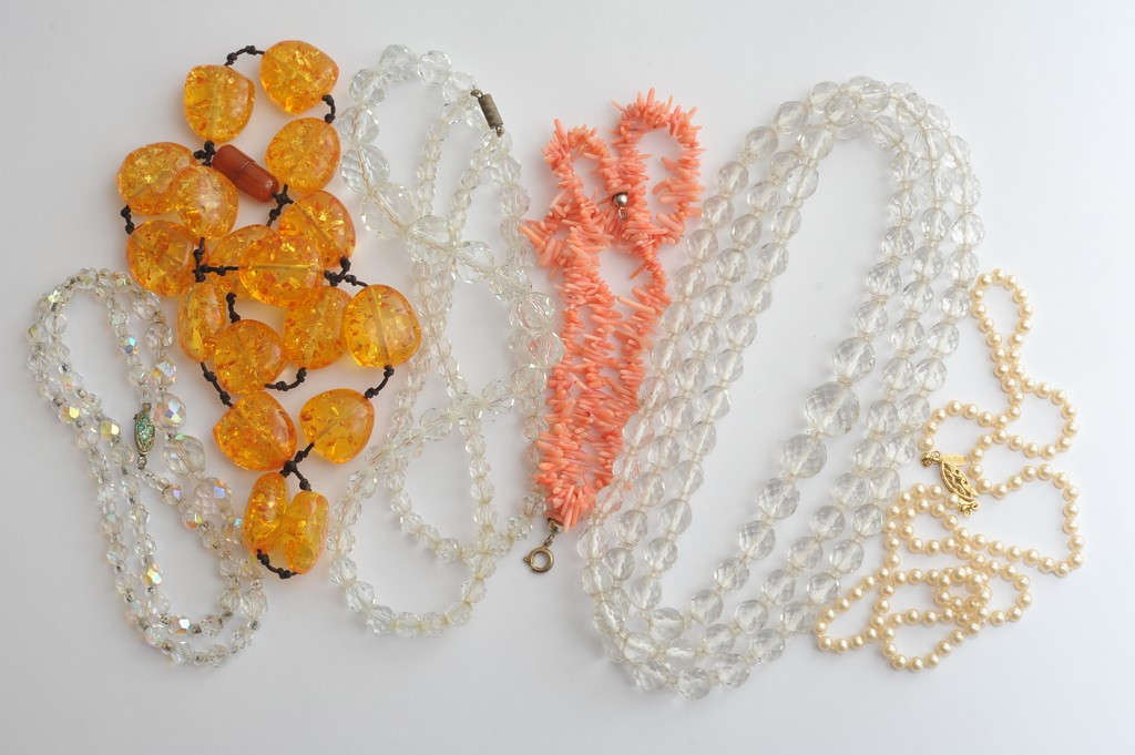 A collection of nine bead necklaces including coral, Napier simulated pearls and vintage crystal