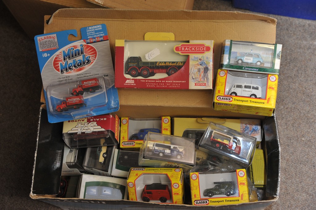 A collection of boxed small scale die-cast  cars