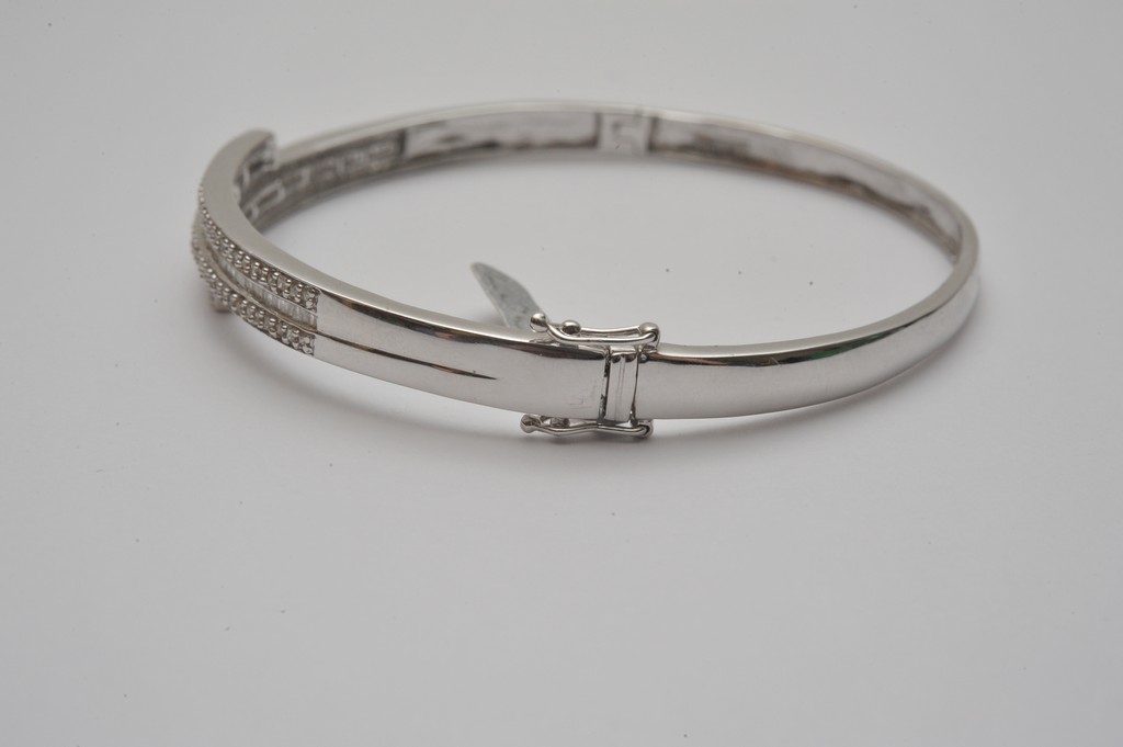 A ladies 18ct white gold bangle profusely set with round and baguette cut diamonds - Image 2 of 3