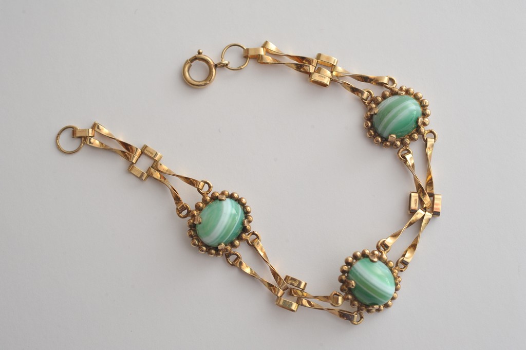 A 9ct gold bracelet set with green lace agate cabochons