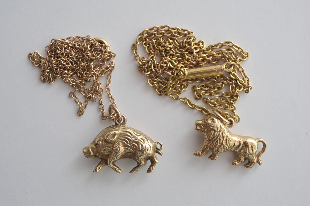 Two 9ct gold animal pendants with chain attachment