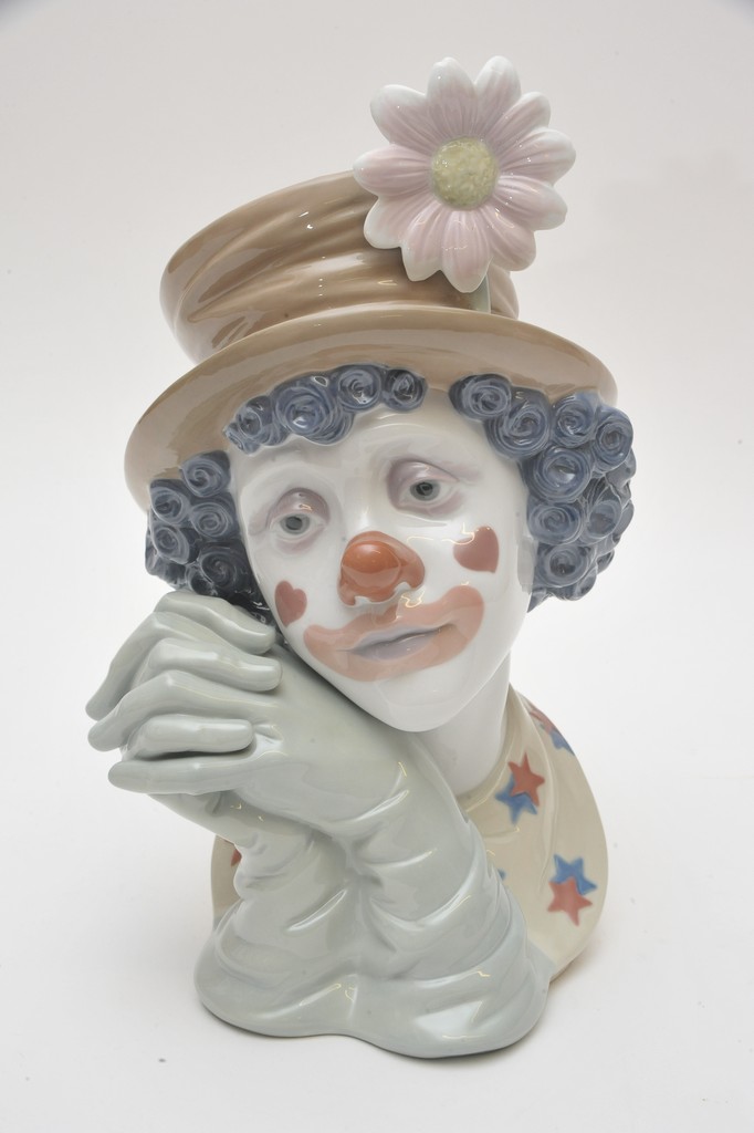 A similar large Lladro bust of a clown wearing a top hat