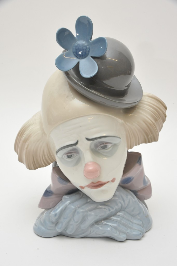 A large Lladro bust of a clown wearing a bowler hat