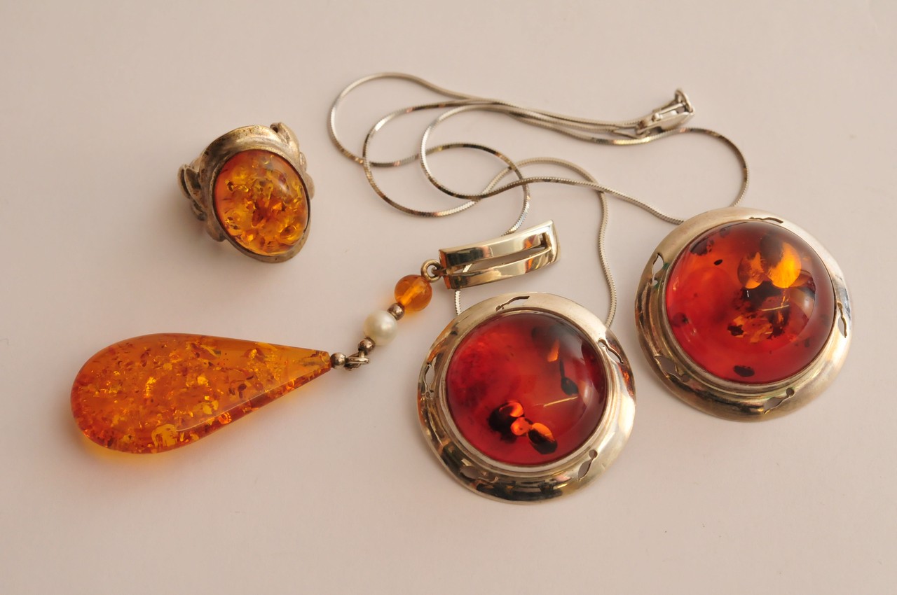 A Danish silver and natural amber, modern design necklace with conforming clip on earrings and a