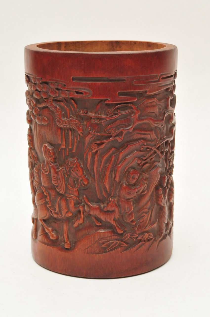 A Chinese bamboo brush pot carved in relief in the Canton style. Height: 18.5cm approximately
