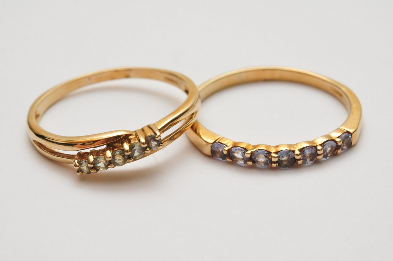 Two ladies 9ct yellow gold rings set with single rows of cut stones