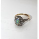 18ct Yellow Gold with Platinum Setting of an Opal surrounded by 10 Diamonds. Size N 4.46 Grams
