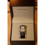 Burberry BU1101. 25mm x 40mm Case. Calibre 1069, 6 Jewel Quartz Movement. Original Strap & Buckle.