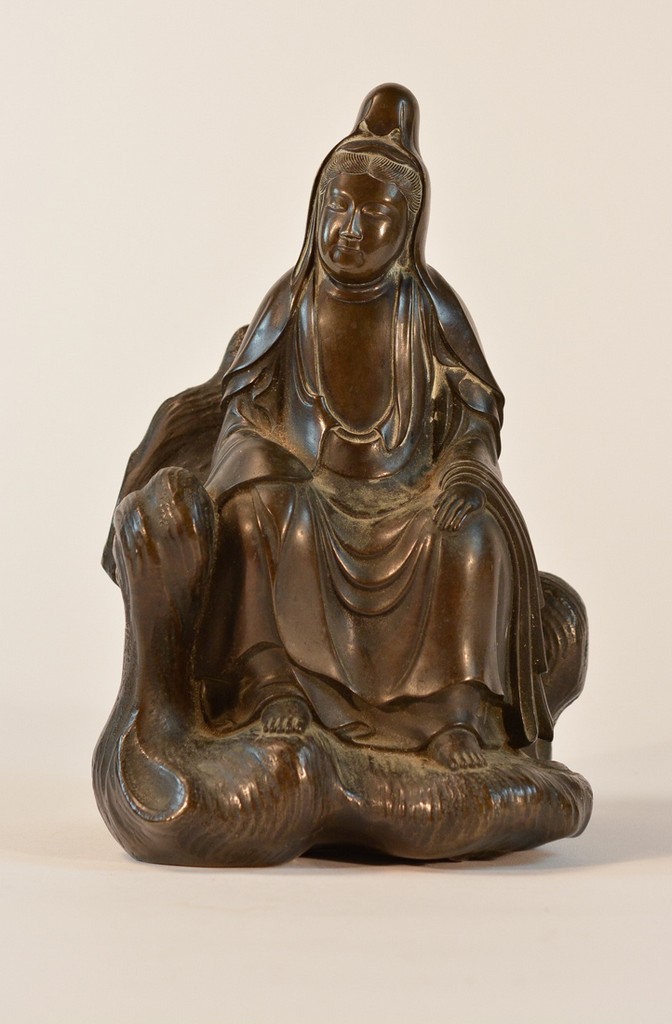 Chinese Bronze Kuanyin Seated Resting on Rock 18/19th cen, measures 9.5"h 5" x 6"w  , unsigned