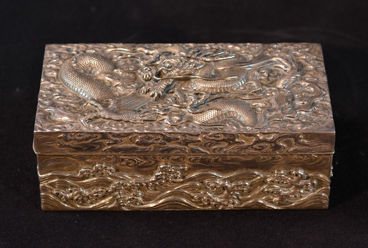 Japanese Silver Box with Dragon Motif Meiji period, measures 6.8" by 3" and 2.6"h     Please visit