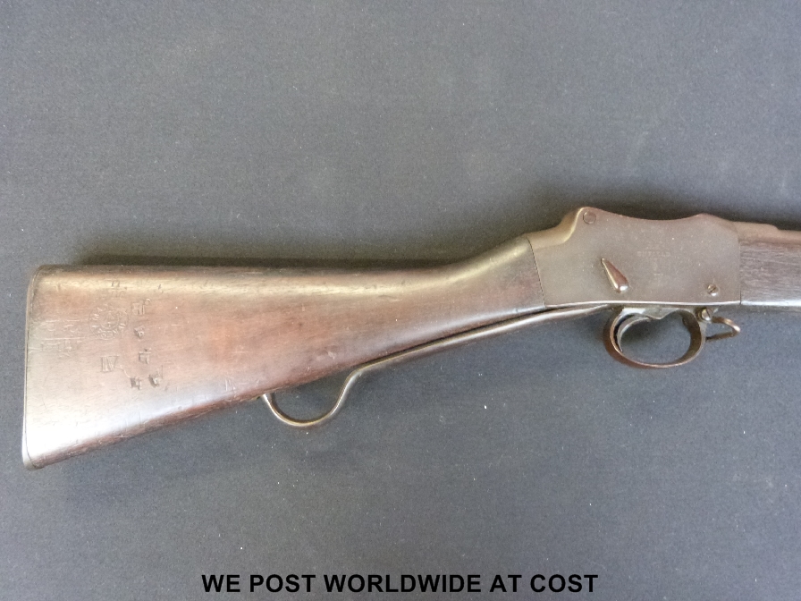 A Martini Henry MK 4 1887 rifle together with a Wilkinson bayonet and scabbard. ALL WEAPONS AND