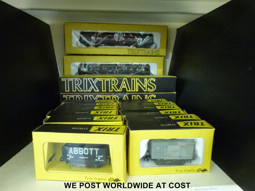 16 Trix 00 gauge carriages and wagons, all in original boxes together with two Trix empty locomotive