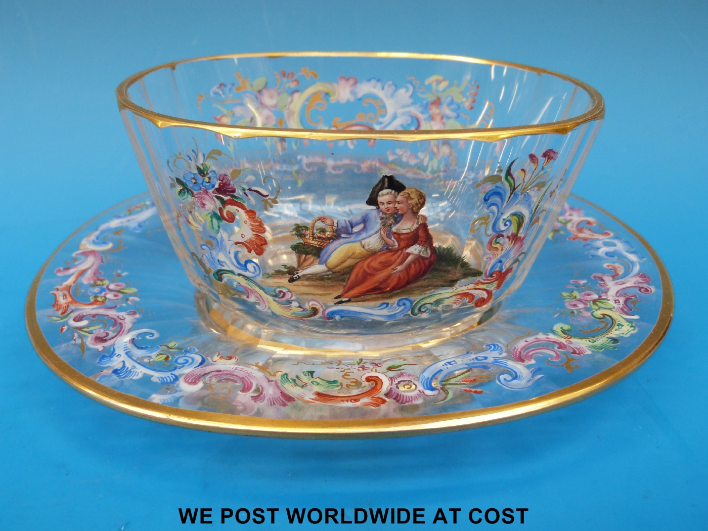 A Lobmeyr cut glass and enamelled bowl and matching plate with a hand painted scene of a young