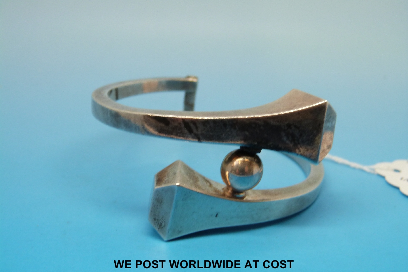 A designer white metal bangle marked 950 with registration no ?534 (1st digit obscured), 59.5 g