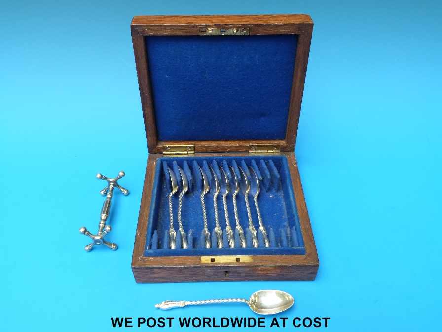 Nine silver Apostle spoons, five Mappin & Webb, four Walker & Hall, and a knife rest