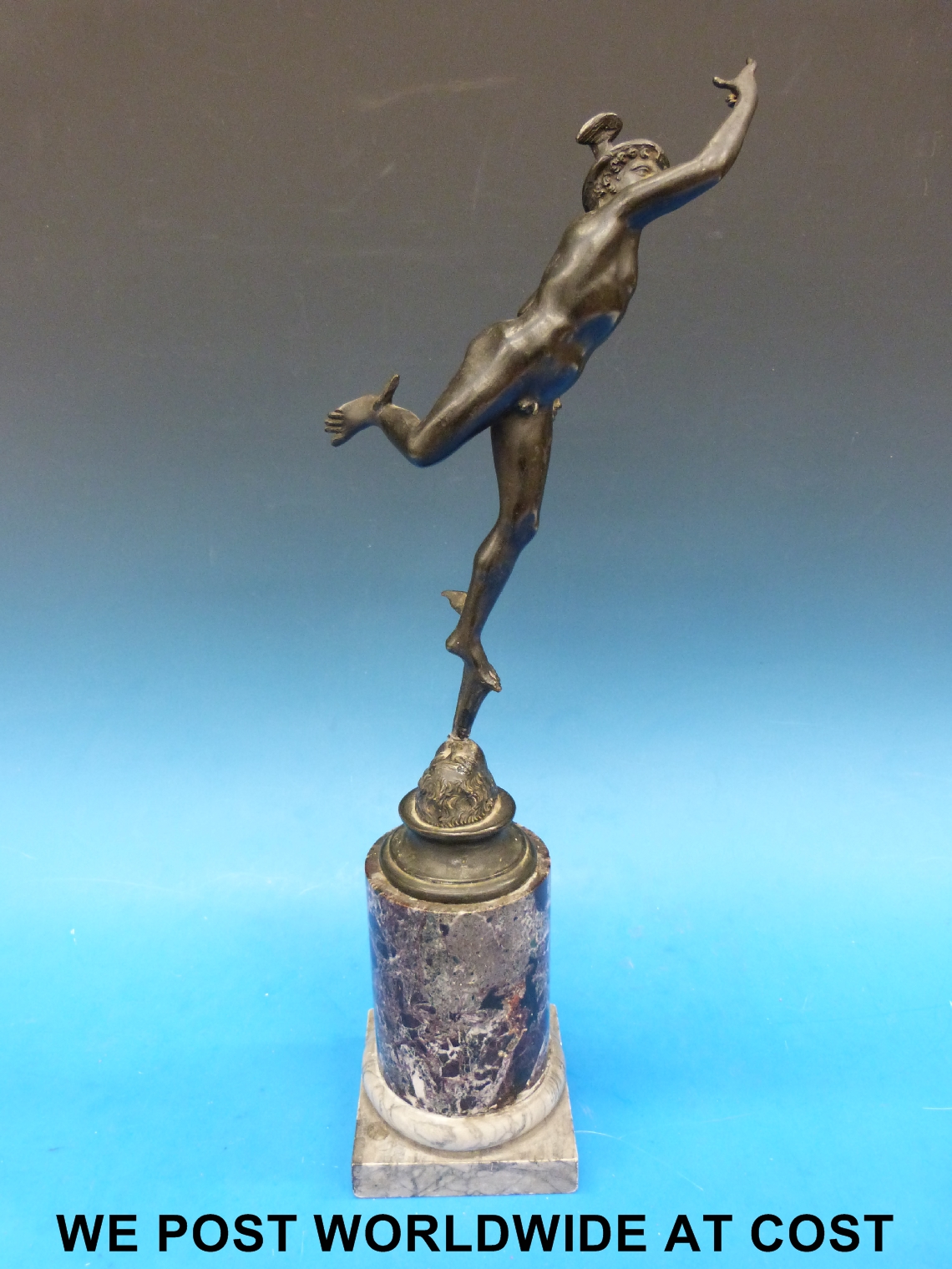 A 19thC cast metal statue of Mercury on a marble column base