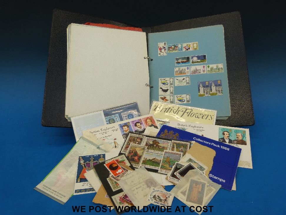 Collection of British colony and world stamps in a ring binder including Cayman Islands, St