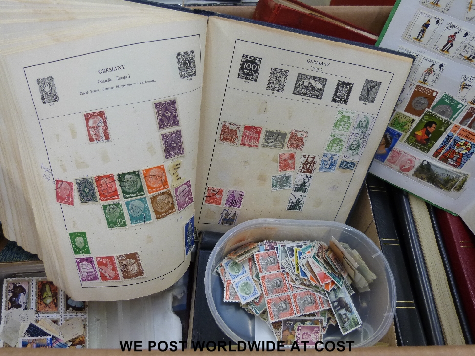A large box of all world stamps, loose and in albums