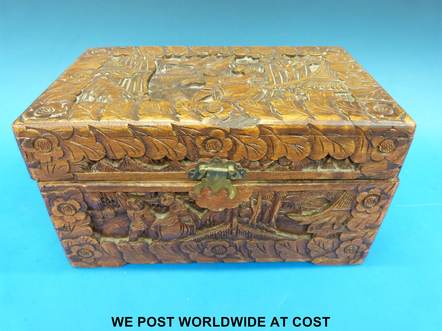 A carved Chinese camphor wood box