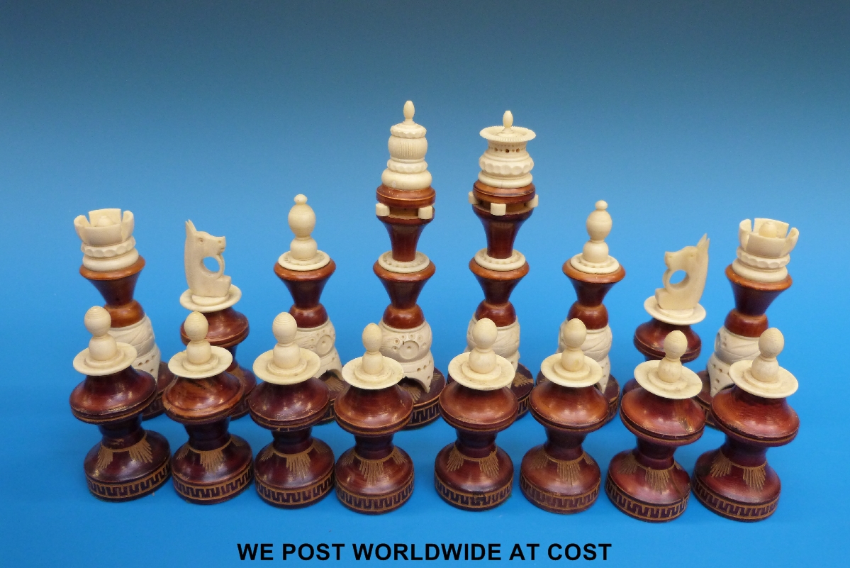 A wooden and bone chess set, height of king 16 cm.