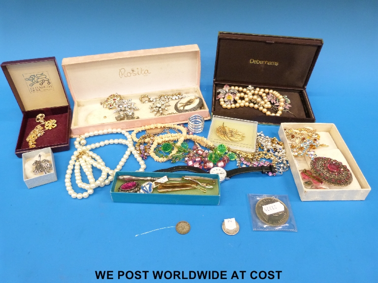 A quantity of costume jewellery including necklaces, bracelets, coins etc