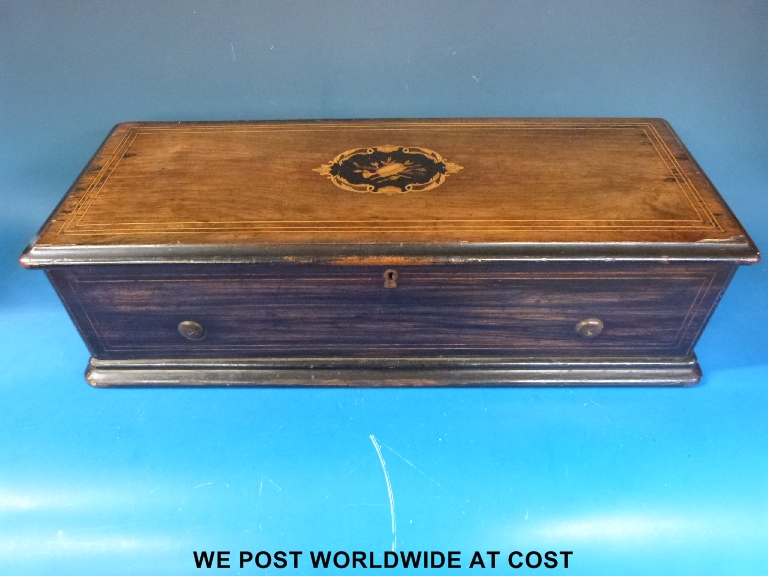A 19thC musical box playing 14 airs ( 2 per turn) in inlaid case.