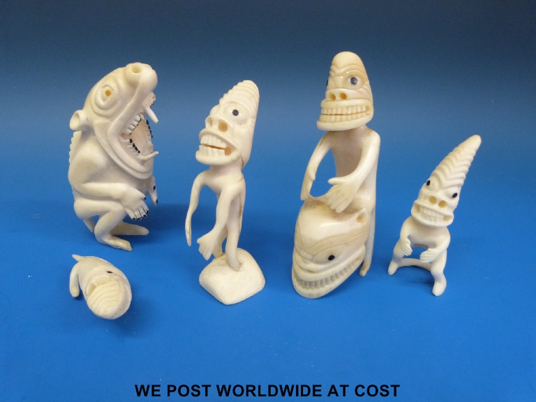 A collection of five Greenland Inuit marine ivory tupilaks, the largest 11.5cm, together with