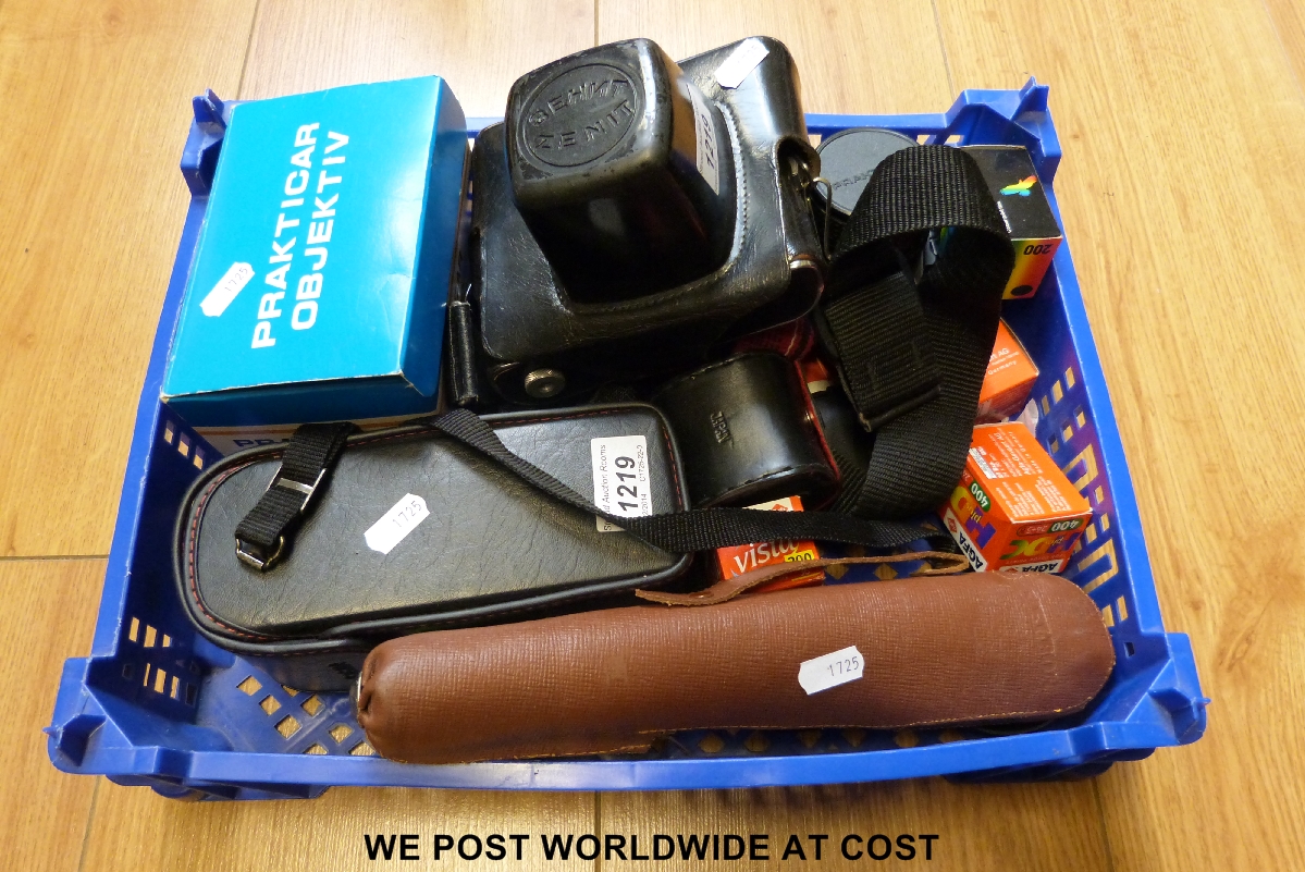 A small collection of cameras and camera equipment to include a Russian Zenit camera