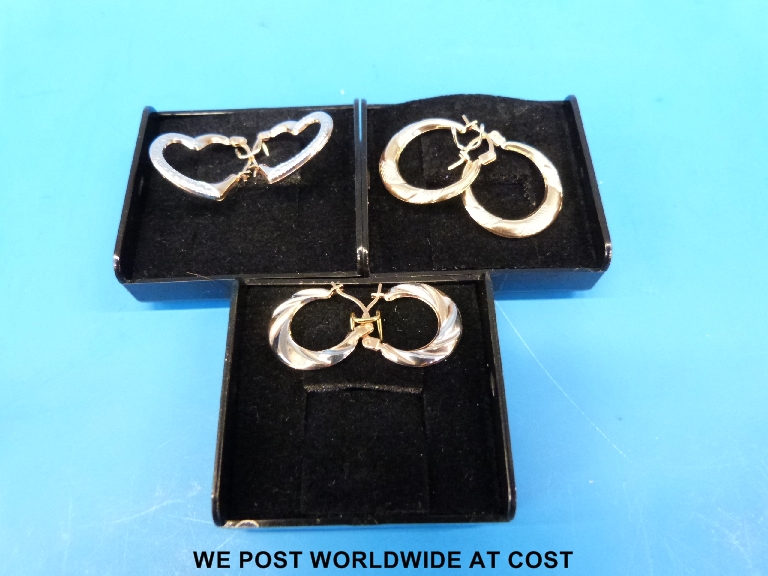 Three pairs of 9ct gold earrings.