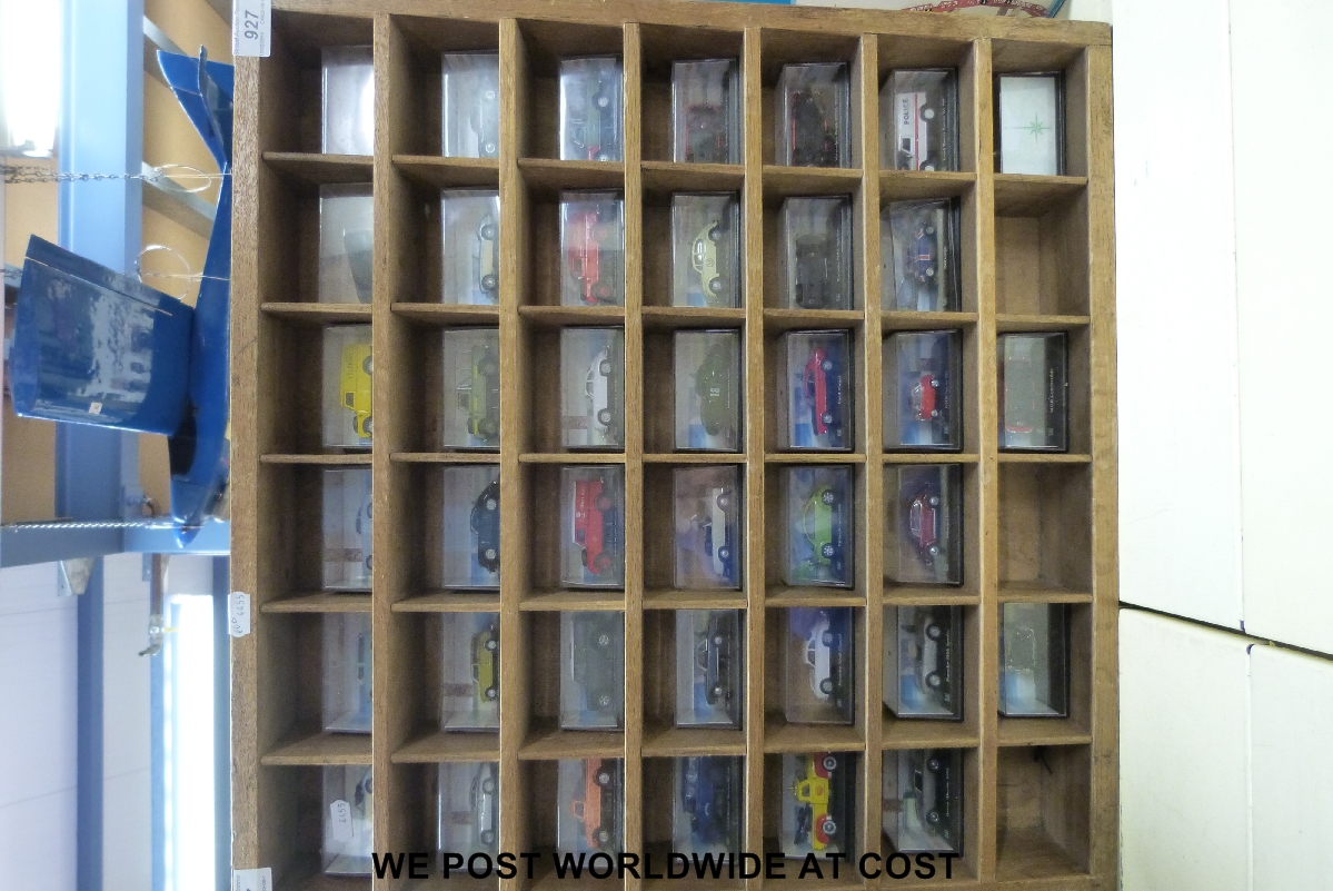 A collection of 39 Oxford die-cast model cars,all in original cases, together with a light oak