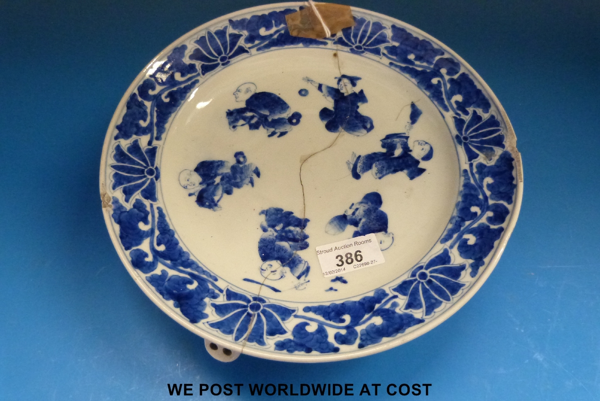 A 19thC Chinese blue and white hot water plate