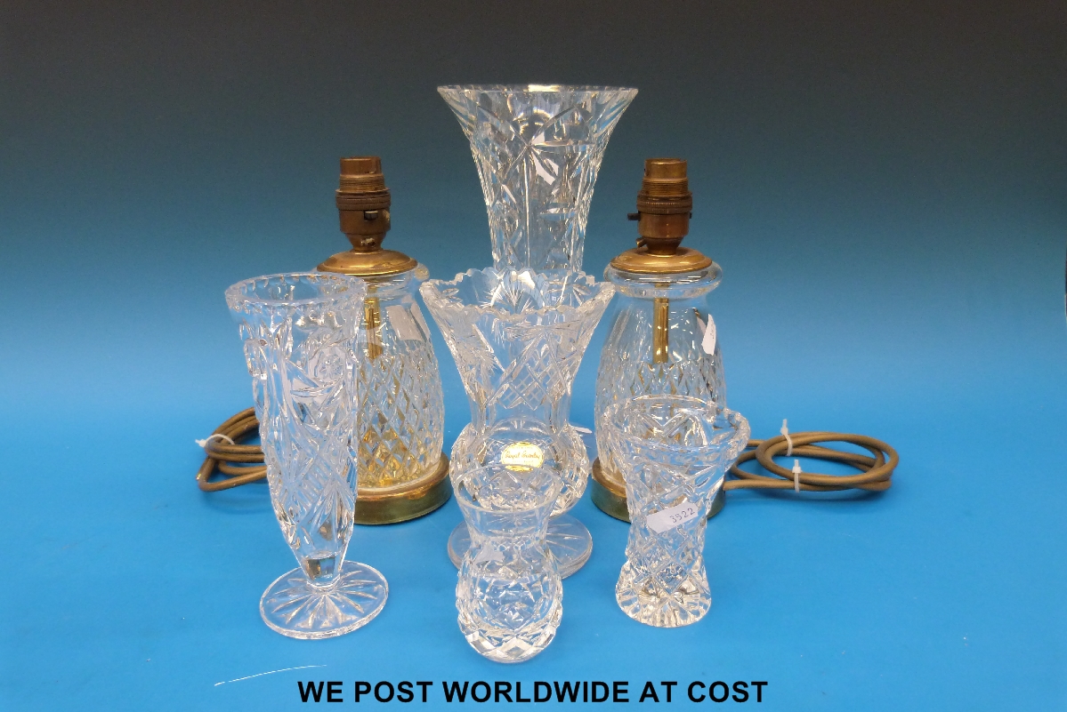 Quantity of crystal vases together with a pair of Royal Brierley crystal table lamps.