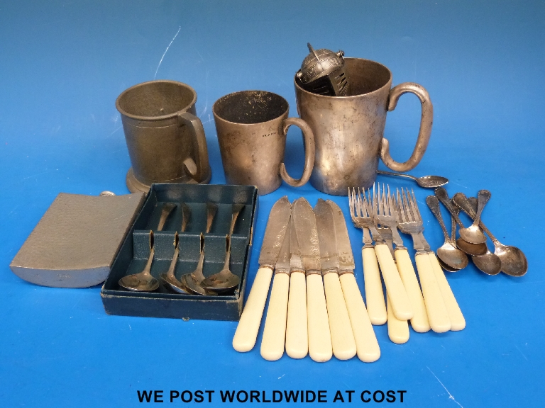 A quantity of silver plated mugs, pewter flatware etc