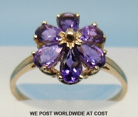 9ct gold daisy ring set with six amethysts, 1.6 g, size P.