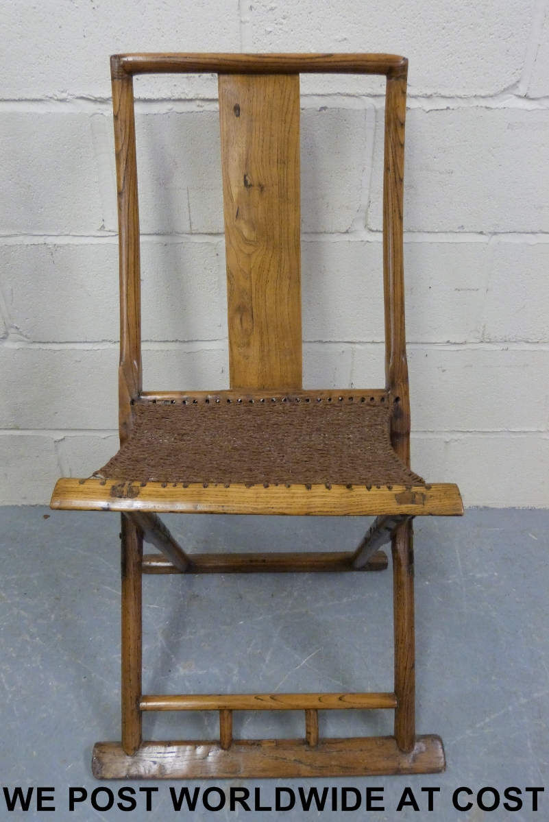 A Chinese elm folding chair and another