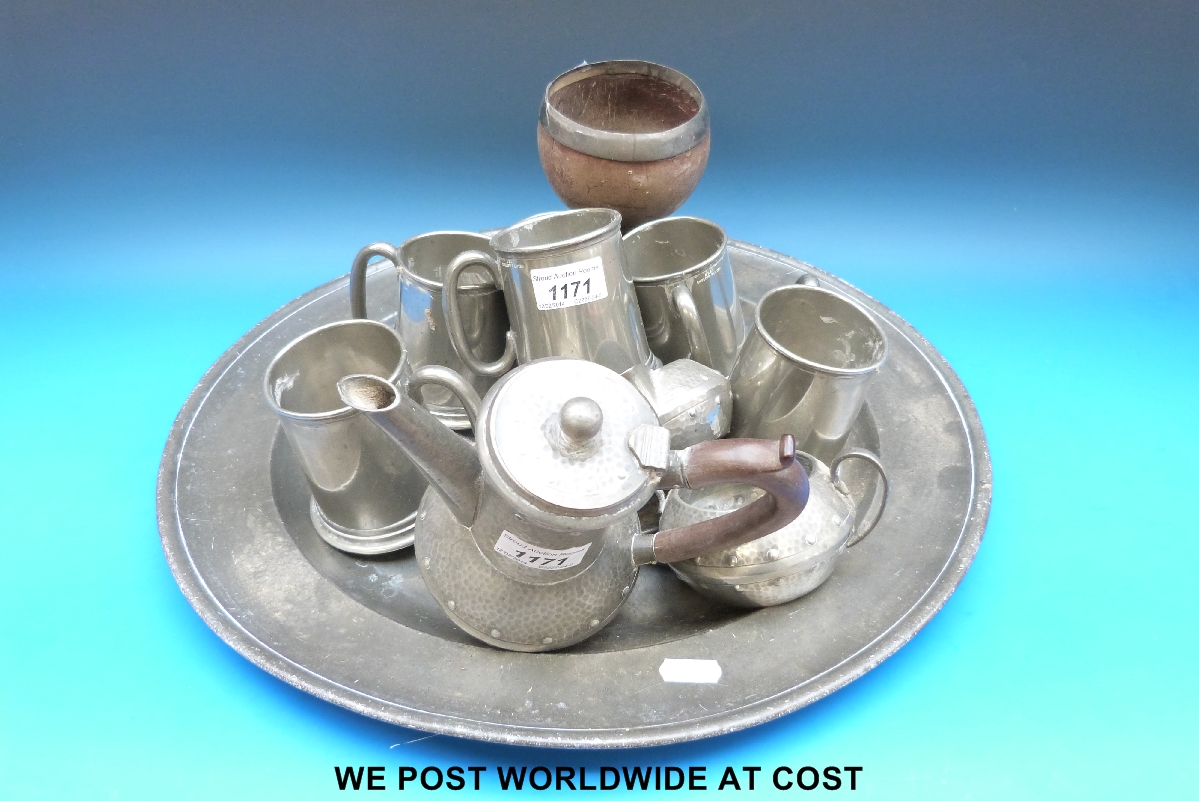 Large collection of pewter including large charger, treen goblet, hammered pewter etc