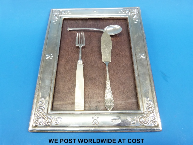 Hallmarked silver photo frame to suit 5 x 7 photo, hallmarked silver butter knife and spoon and a
