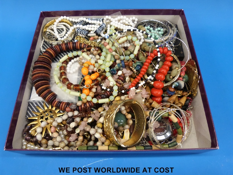 Box of costume jewellery including bead necklaces, bangles etc.