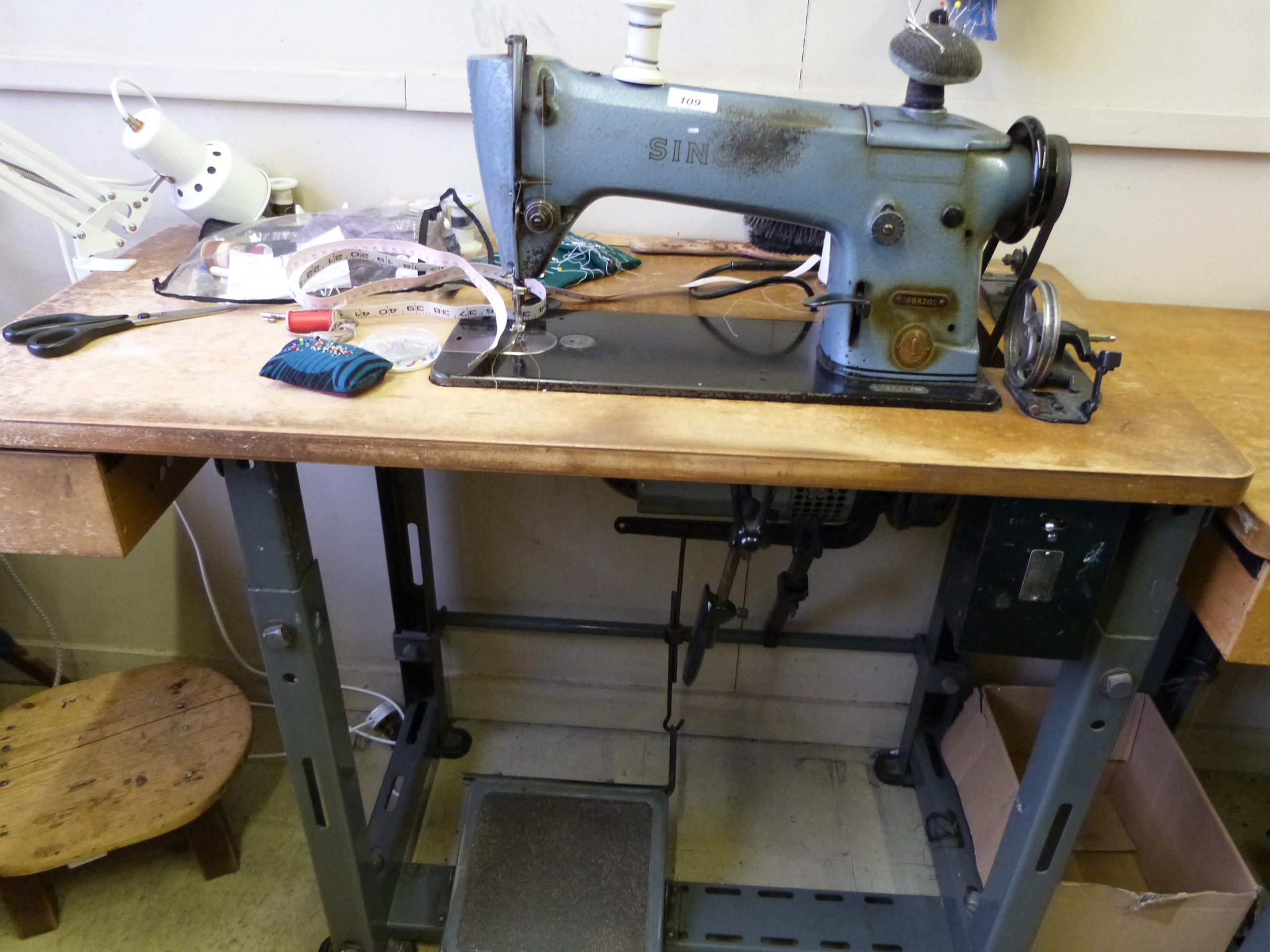 A Singer industrial sewing machine marked 196K205, in use at time of cataloguing